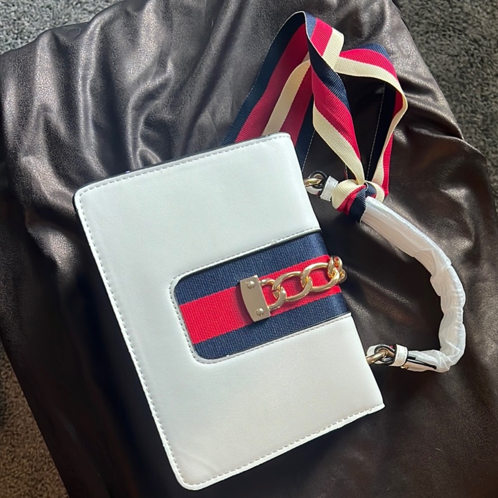 Stylish White Crossbody Bag with Striped Strap
